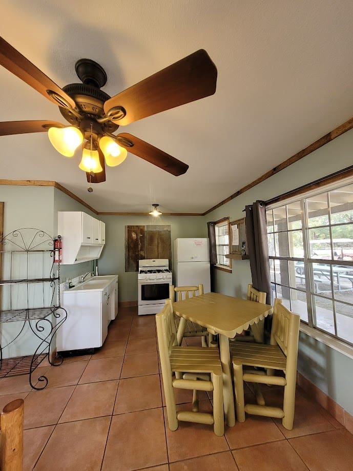 Cabin kitchen with table and chairs.